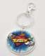 Dress your keys up with this funky keychain! It features a flaming red heart with wings wrapped in a Love banner, flying through a blue sky. The tight-fitting clasp keeps your keys close together and organized. Its unique design makes it fit nicely in your pocket or purse, or attach it to a belt loop on your jeans to make a fashion statement! 