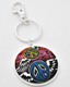 Add some flair to your keys with this groovy dual-faced keychain! One side features two colorful peace signs with wings, while the other side is engraved with the words Imagine and Peace around another peace sign. Its tight-fitting clasp keeps your keys close together and organized, while its unique design makes it fit nicely in your pocket or purse. Pair it with our Flying Heart Keychain to complete the set!