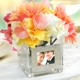Our Square Glass Vase with Photo Frame is a unique way to display your most prized picture. Because of its unique versatility, this dual frame and vase works great as a decorative centerpiece at wedding receptions, bridal showers, or even as a gift for a bridal party attendants. Bring them home and embellish everything from fireplace mantles to end tables with all your most cherished memories and decorations. Each table vase adds an exquisite decorative element to any special event and when the party is over it easily becomes a showpiece in your home for many years to come.