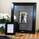 Our Signature Picture Frame with Engraved Photo Mat is one of our most unique keepsakes to date! It combines contemporary style to an age old wedding tradition. Fashioned with an ultra creative metal photo mat, this statuesque wooden frame not only holds one of your favorite 8 x 10 pictures, but it also doubles as a guest book alternative, allowing all your friends and family to sign their names and well wishes. Personalized free of charge, this fabulous frame and signature mat will be a keepsake that youll treasure for years to come. And dont let this signature memento go to waste. It also works famously for bridal showers, anniversaries, graduations, going away parties and every special occasion in between! Set includes wooden picture frame, micro fiber polishing mat, guest instruction card and signature engraving scribe. Smaller frame shown with instruction card is not included. 