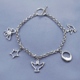 This inspirational charm bracelet includes a dove, moon, angel, star and butterfly. Send a message that will inspire her and remind her of how special she is. Includes manufacturers warranty. Great for religious celebrations such as confirmations, communions or Easter holidays.