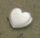 Your true love wont have a heavy heart when you give him/her this symbol of your affection. Ideal for home or office, our personalized silver-plated heart-shaped paper weight, fashioned from durable brass, is a constant reminder of your love as well as a useful desk accessory for that busy man or woman in your life. Makes a great wedding favor, too! Measures 2" x 3/4". Personalized with two lines of up to 20 characters per line.