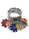 This pretty stretch ring is bursting with enamel flower pendants! 
